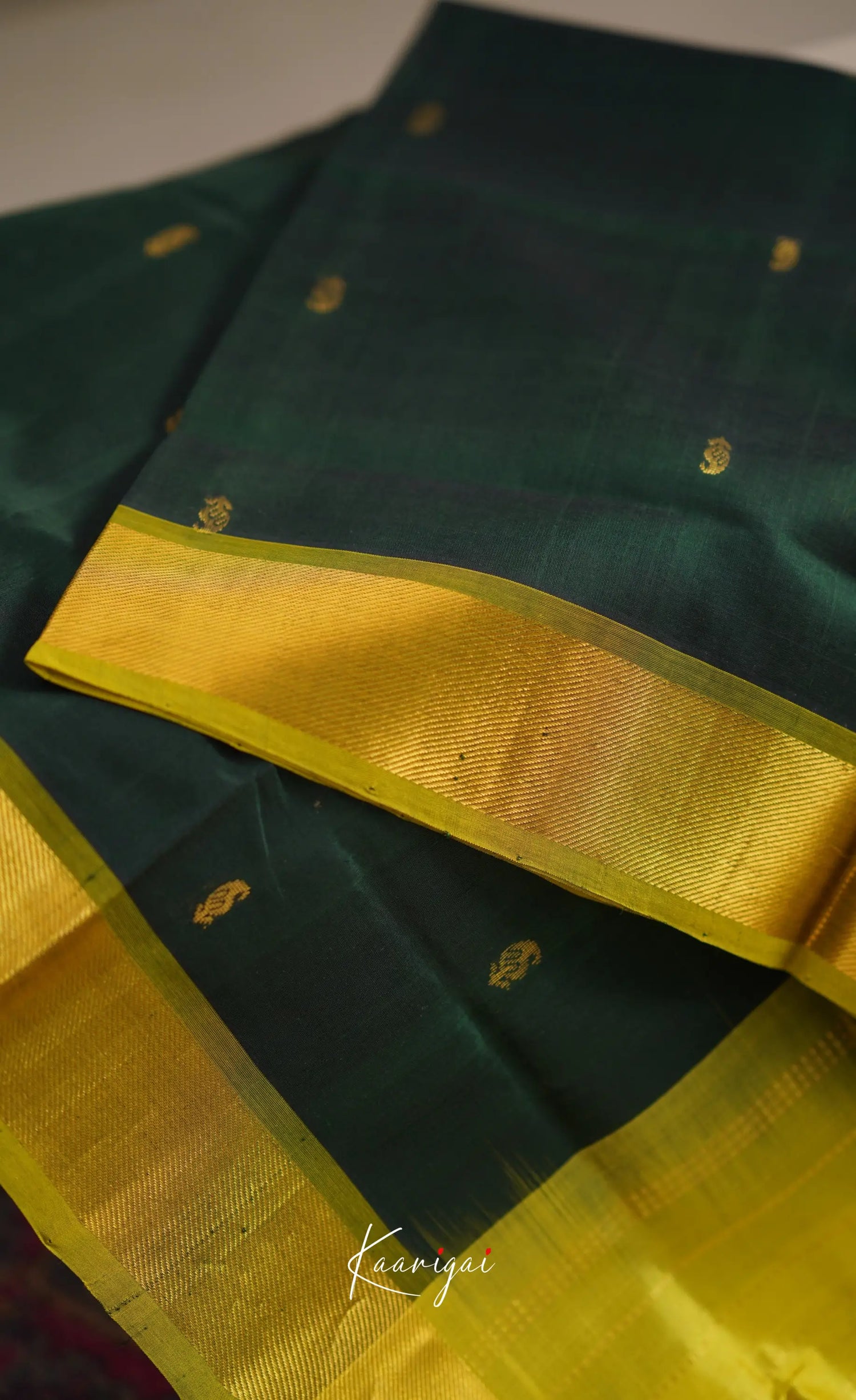 Chaarvi- Deep Bottle Green With Henna Kanchi Silk Cotton Saree Sarees