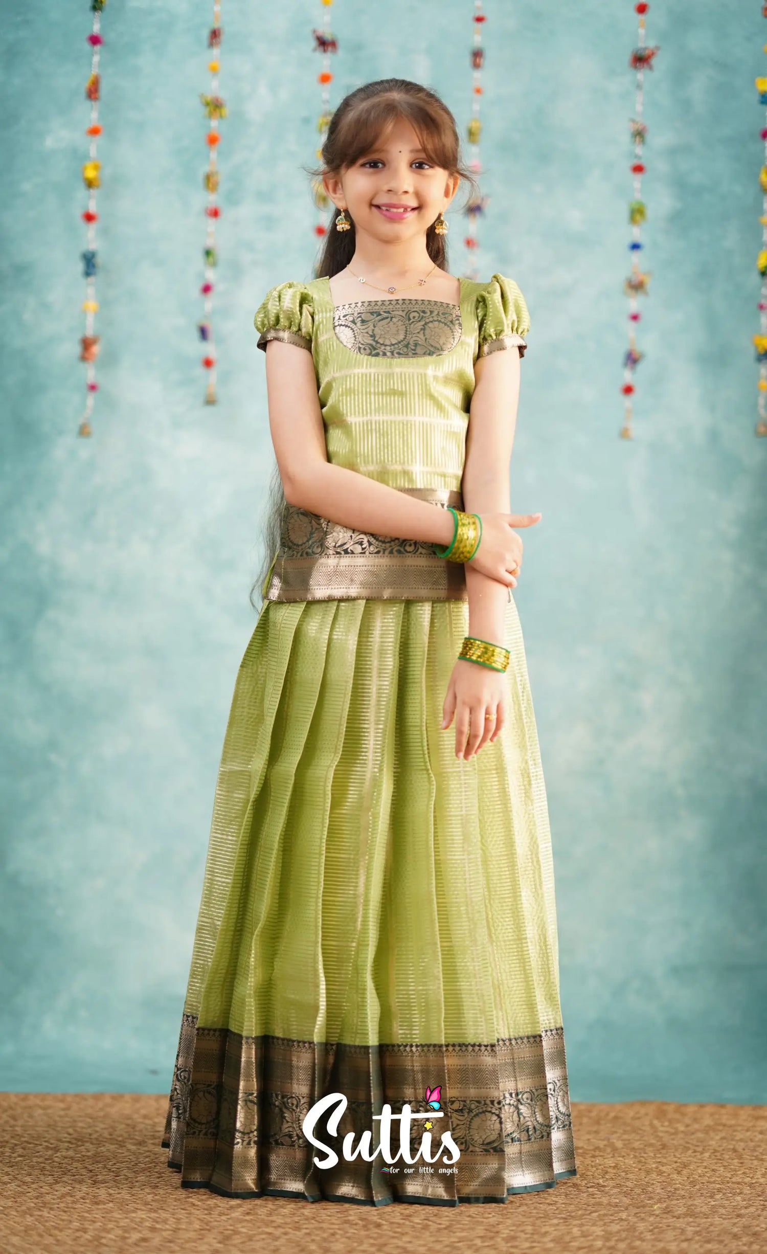 Izhaiyini Pista Green shade and Dark Green tone Organza Pavadai Sattai Ivalinmabia Izhaiyini Pista Green shade and Dark Green tone Organza Pavadai Sattai Ivalinmabia