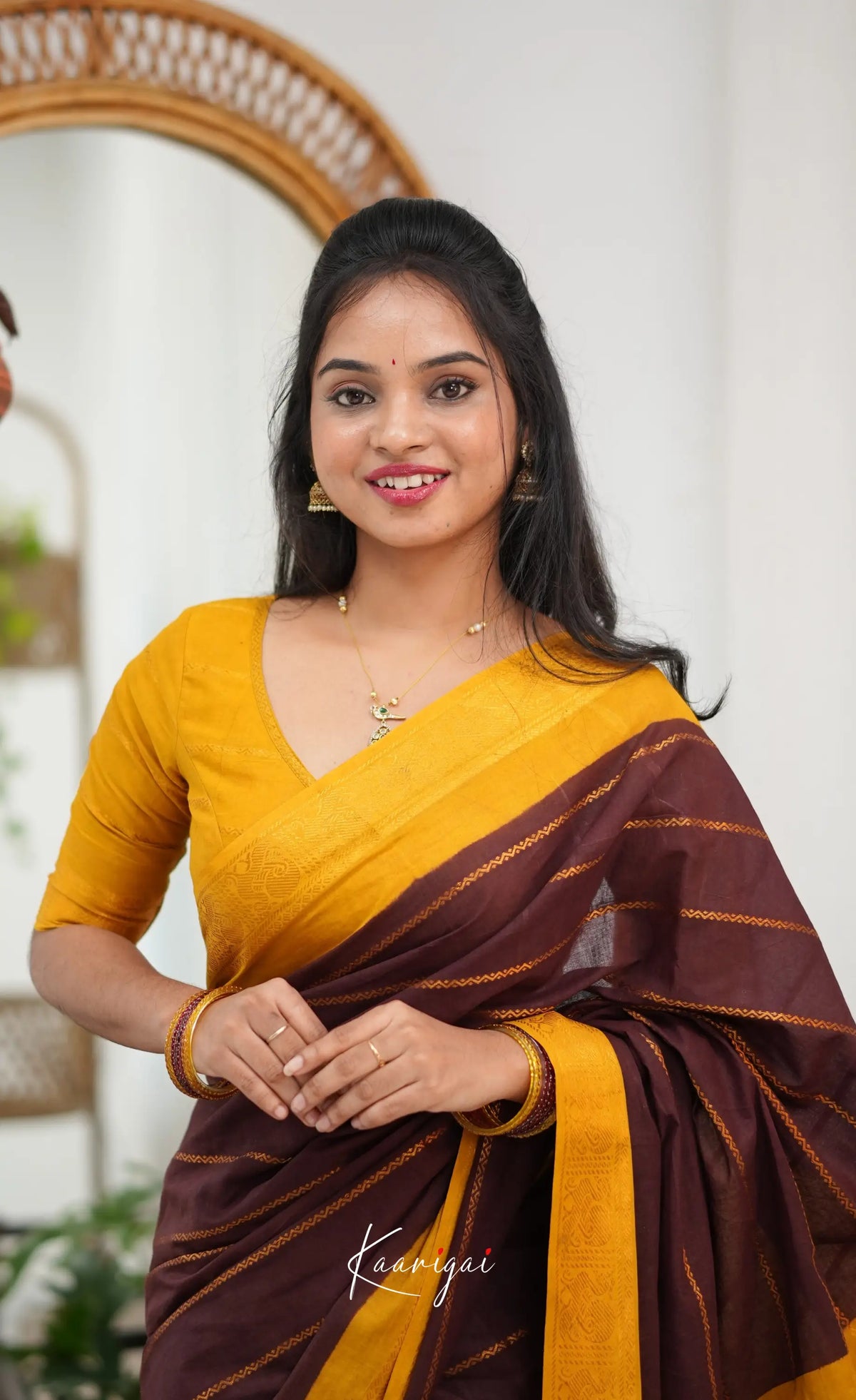 Saaral - Dark brown and Henna yellow Sungudi Saree - Sarees
