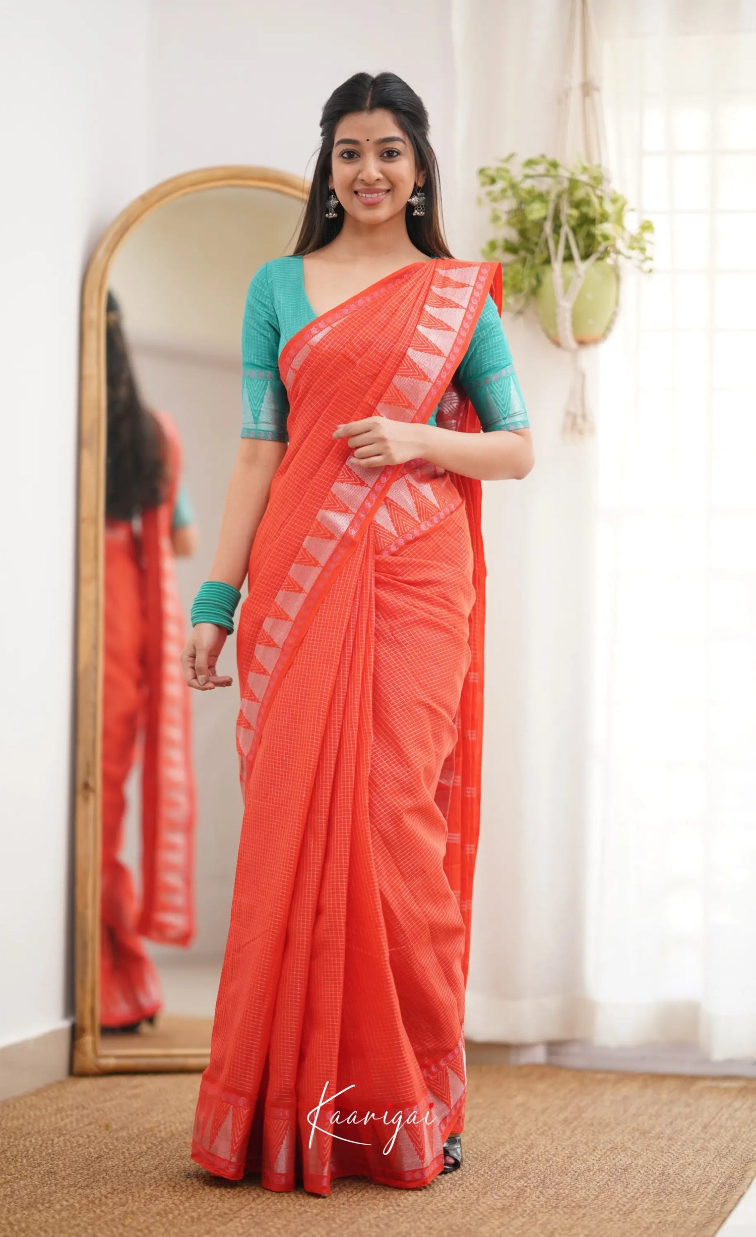 Saaral Orange Shade And Teal Green Tone Sungudi Saree Sarees