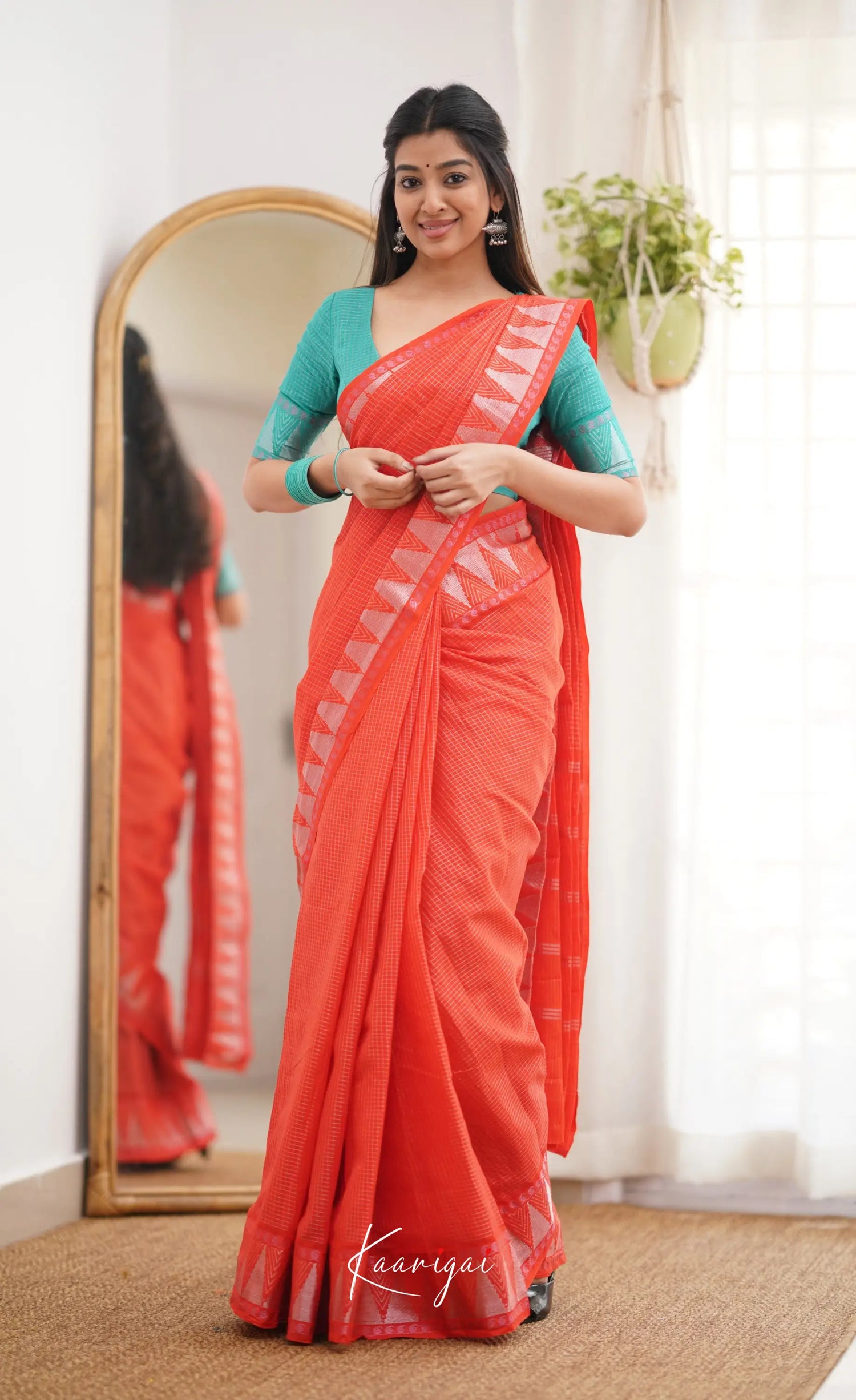 Saaral Orange Shade And Teal Green Tone Sungudi Saree Sarees