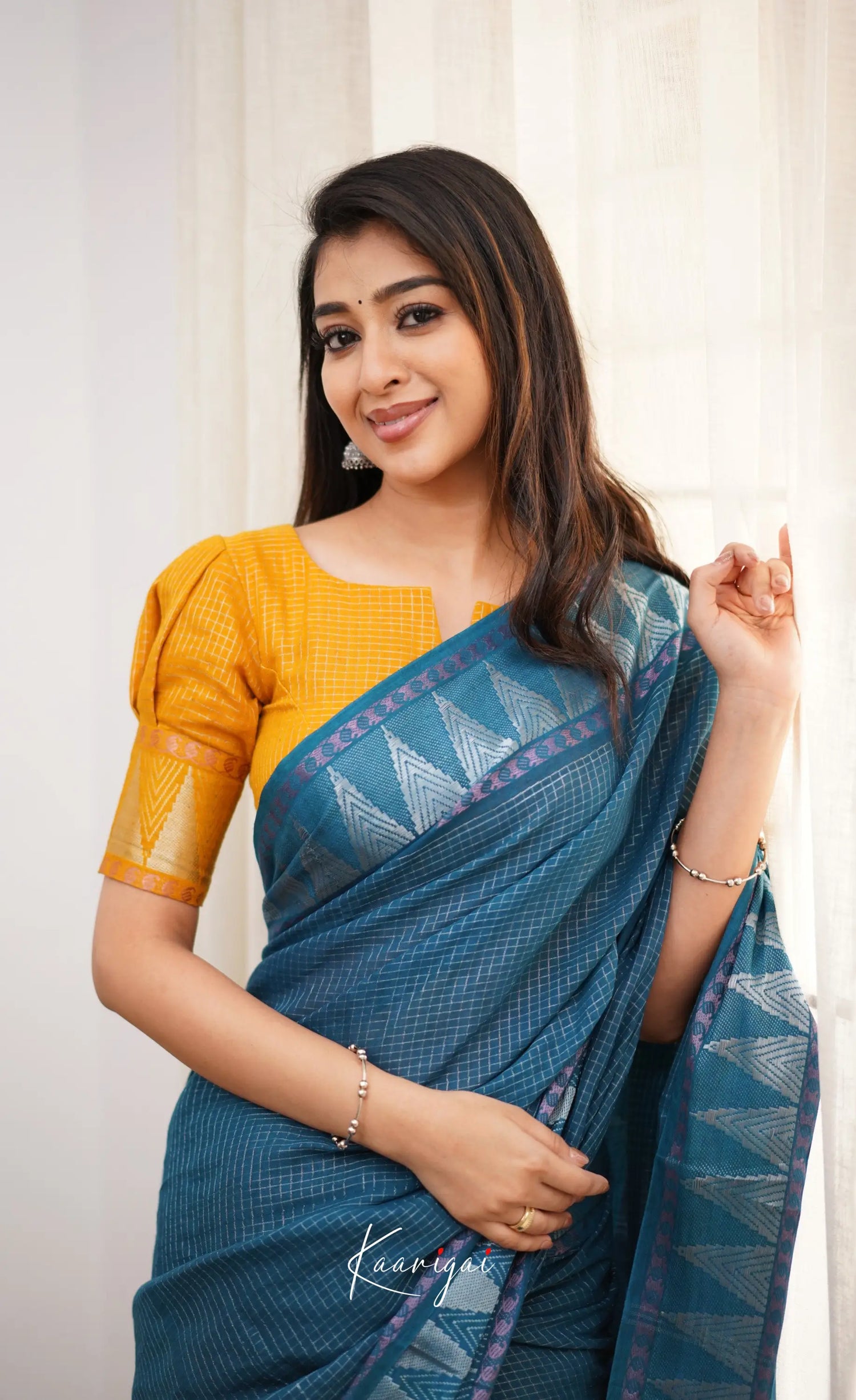 Saaral Peacock Blue Shade And Mustard Tone Sungudi Saree Sarees