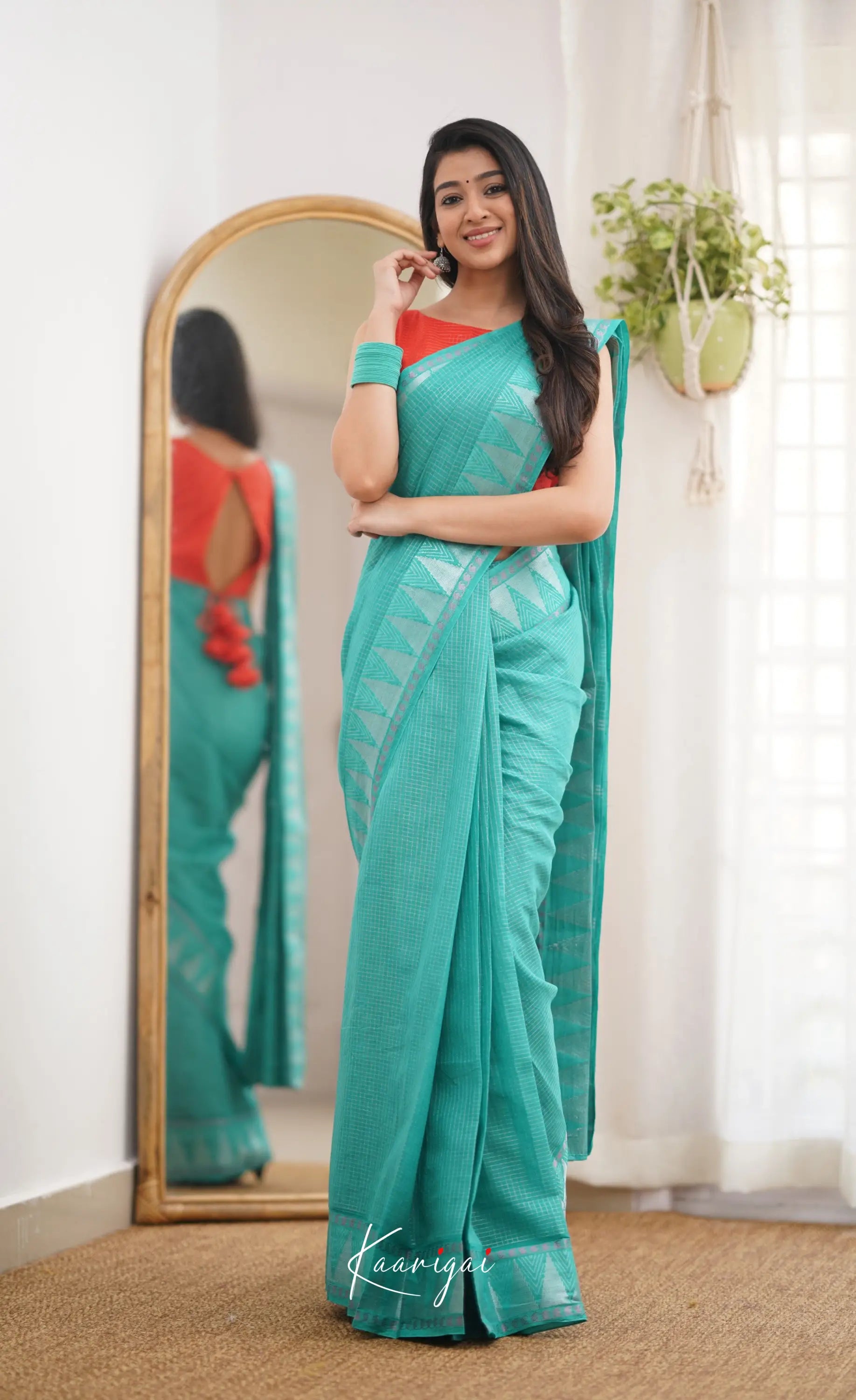 Saaral Teal Green Shade And Orange Tone Sungudi Saree Sarees