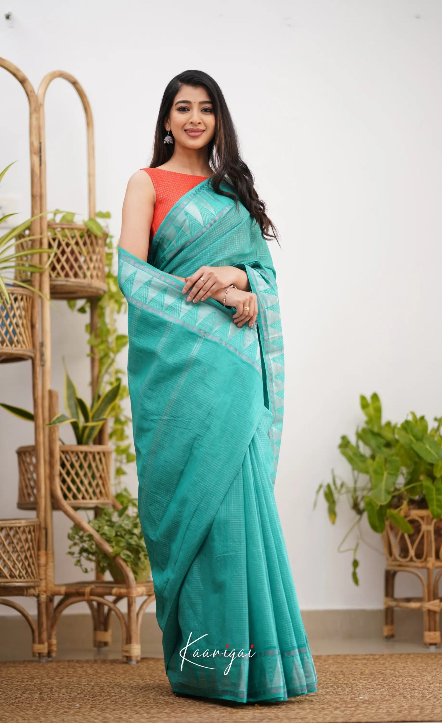 Saaral Teal Green Shade And Orange Tone Sungudi Saree Sarees