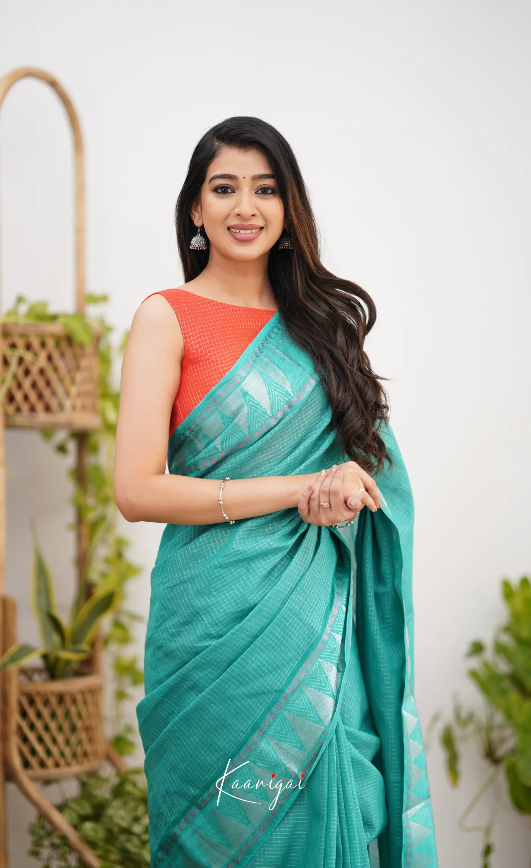 Saaral Teal Green Shade And Orange Tone Sungudi Saree Sarees