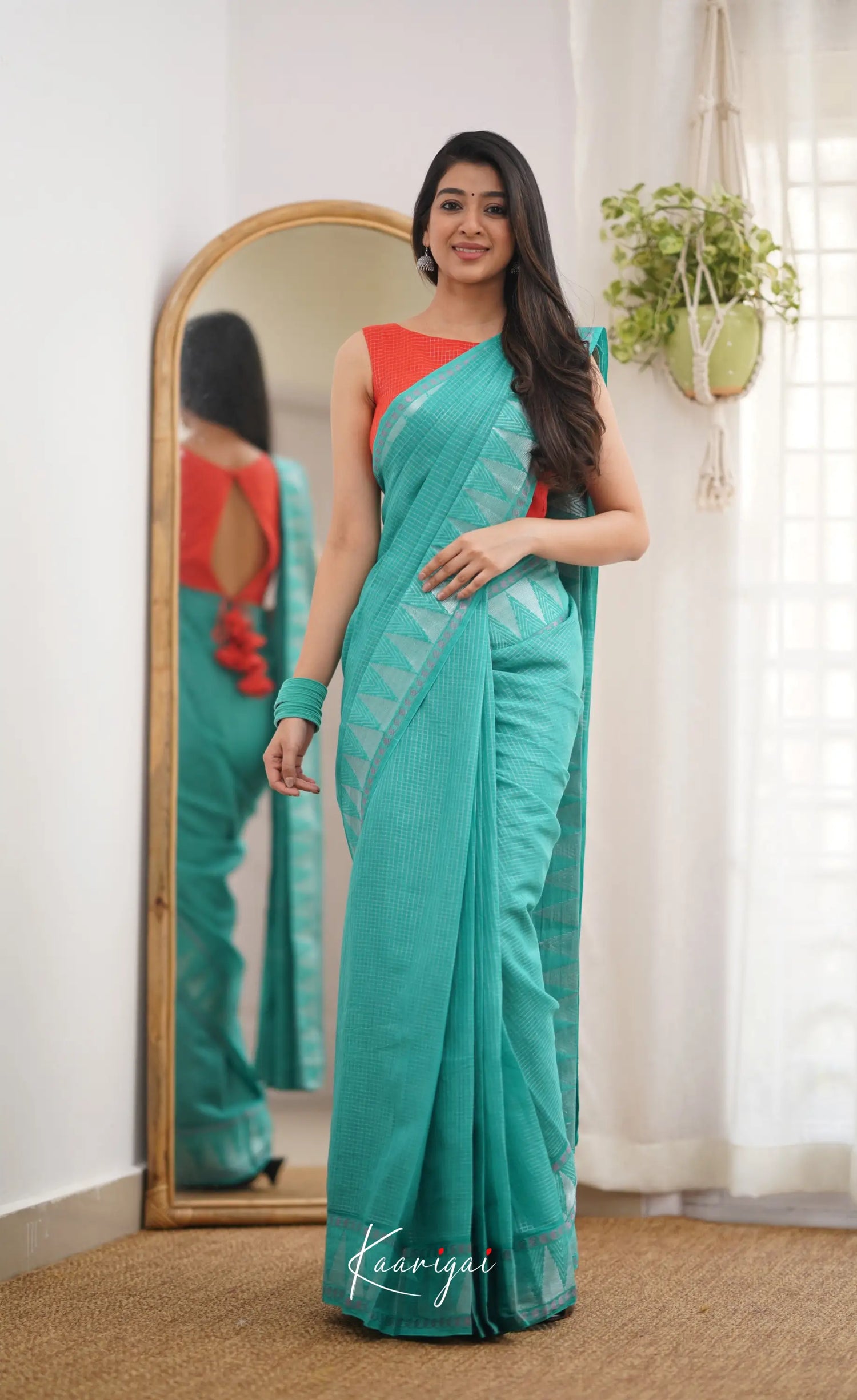 Saaral Teal Green Shade And Orange Tone Sungudi Saree Sarees